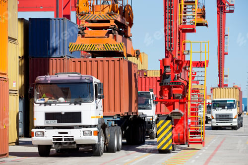 Preview: Wide Shot Of Trucks Transporting Cargos From A Dockyard