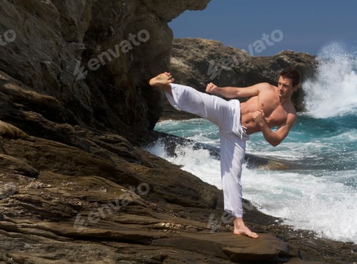 Preview: A Man Practicing Tai Chi By The Sea