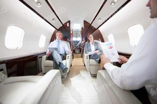 Preview: Business Employees Having A Meeting While Sitting In A Private Jet