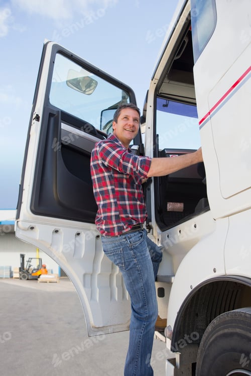 Preview: Truck Driver Climbing Into Cab Of Semi-Truck