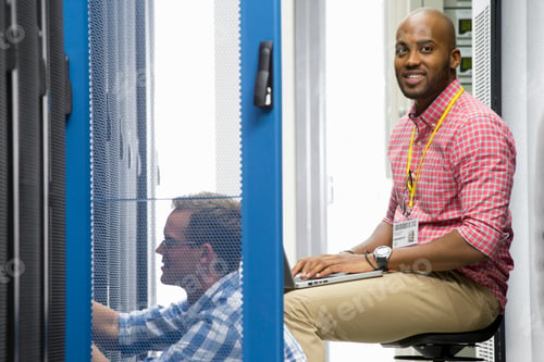 Preview: Smiling Technicians Checking The Server In The Data Center