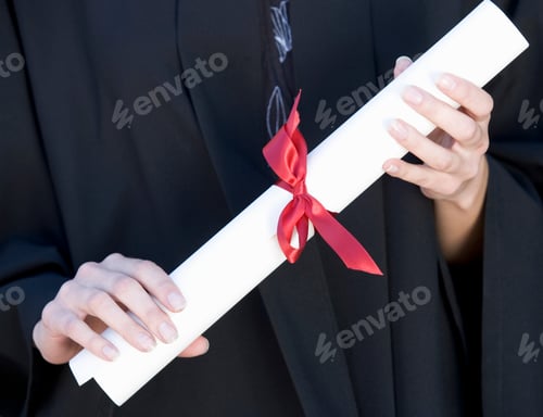 Preview: Close-Up Of A Graduate Holding A Diploma