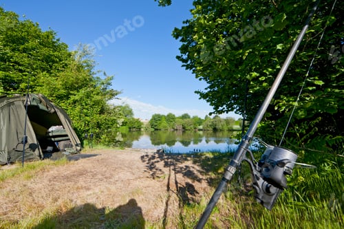 Preview: Carp Fishing Rod And Tent At A Sunny Lakeside