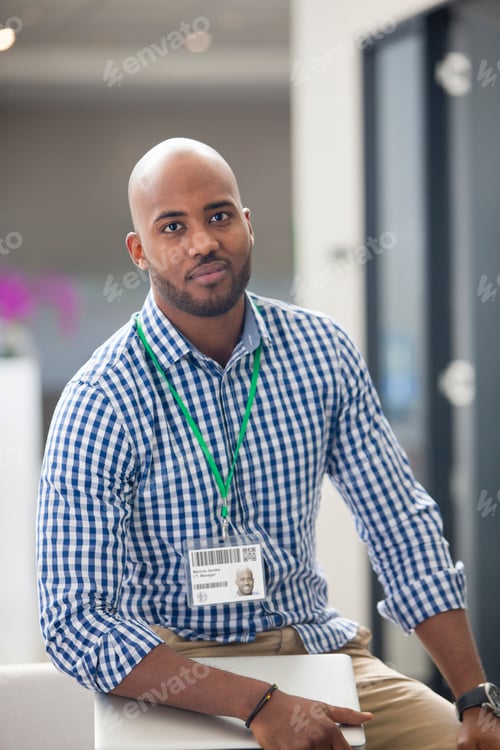 Preview: Portrait Of Male Office Worker Looking At Camera With Laptop