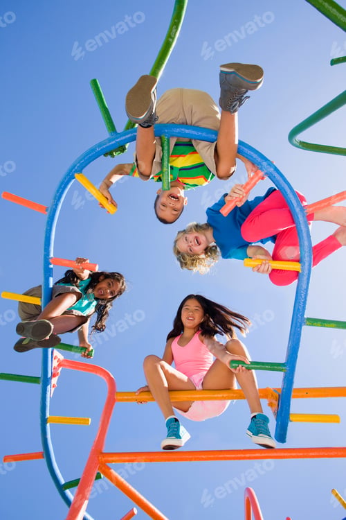 Preview: Low Angle Shot Of Happy Children Sitting On Monkey Bars At A Playground