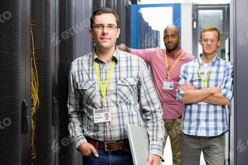 Preview: Group Of Technicians Standing In The Data Center