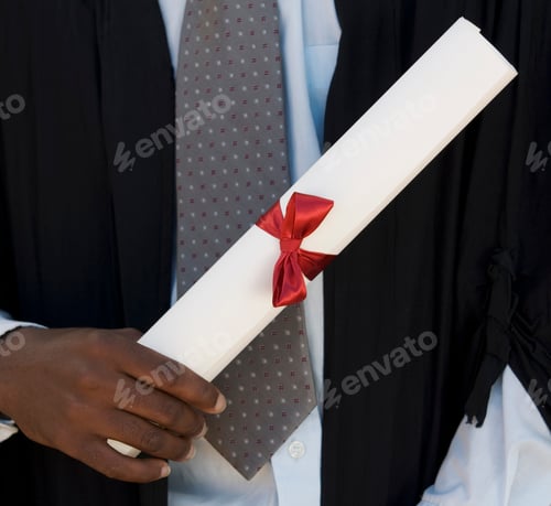 Preview: Close-Up Of A Graduate Holding A Diploma