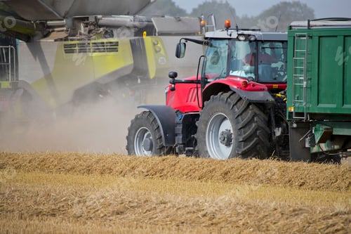 Preview: Combine Harvester Harvesting Wheat Crop With Tractor Behind