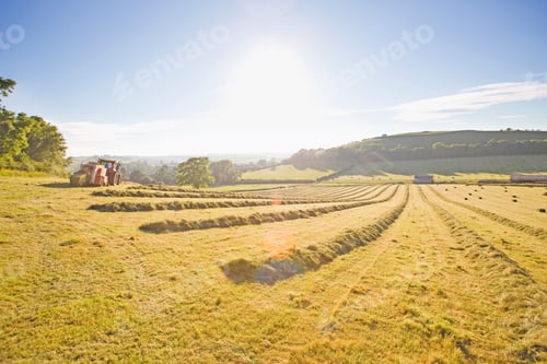Preview: Wide Shot Of A Tractor Baling Hay In The Field