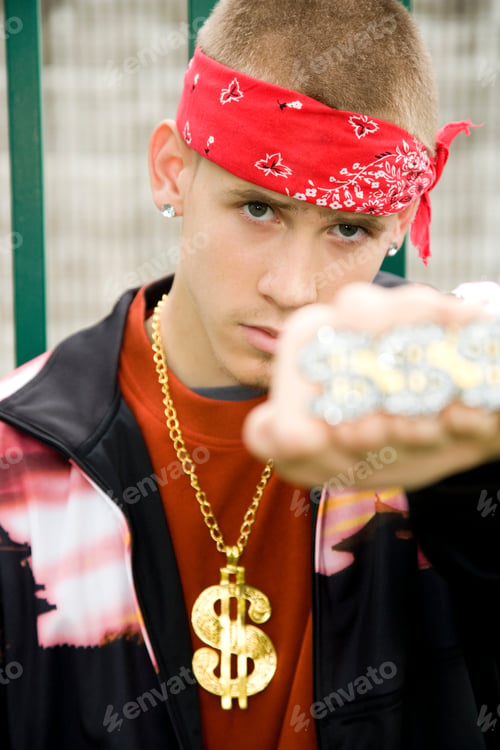 Preview: A Teenage Boy Wearing A Bandana And Money Chain