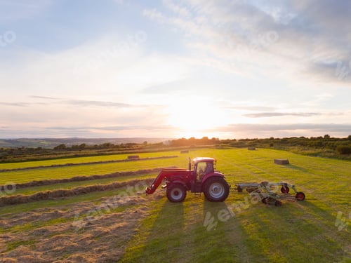 Preview: Tractor Turning Grass To Dry And Make Into Hay