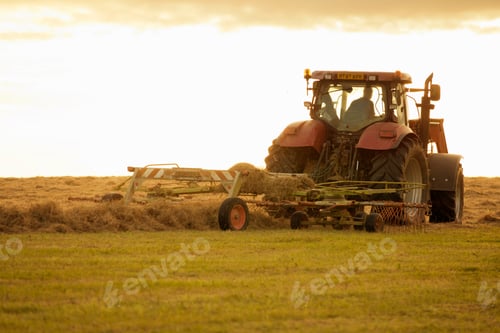 Preview: Tractor Turning Grass To Dry And Make Into Hay