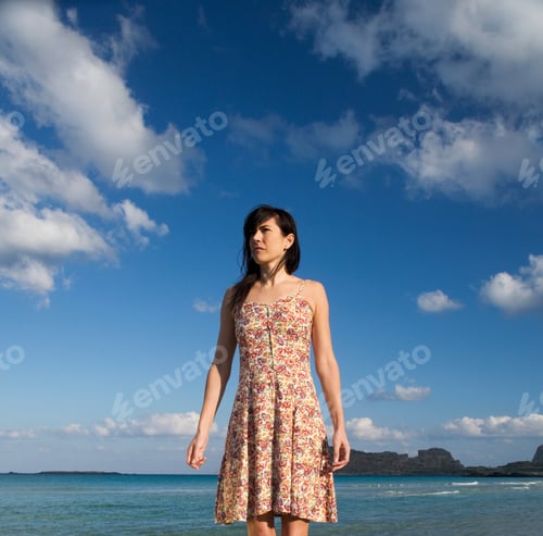 Preview: A Woman Walking Alone On A Beach