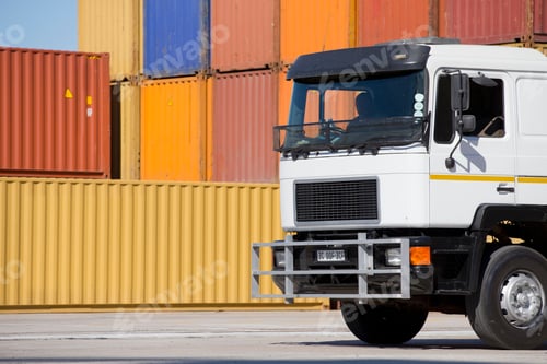 Preview: Close Up Of A Truck At A Dockyard And Stacked Cargos In The Background