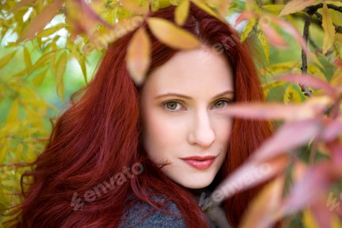 Preview: A Young Woman Standing Under A Tree In Autumn Time