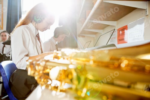 Preview: High School Students Playing Piano With A Shiny Brass Saxophone In The Foreground.