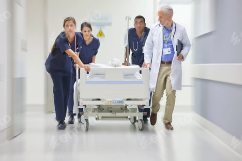 Preview: Emergency Medical Team Wheeling A Patient Along The Hospital Corridor
