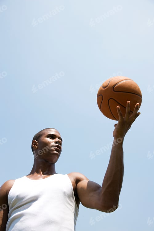 Preview: Young African American Man Holding A Basketball