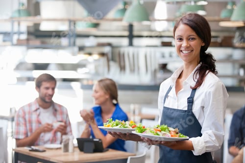 Preview: Wide Shot Of A Smiling Waitress Holding Dishes Of Salad In Both Hands