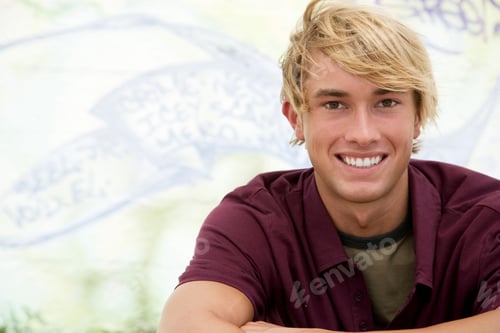 Preview: Portrait Of A Young Man In Front Of A Graffiti Covered Wall