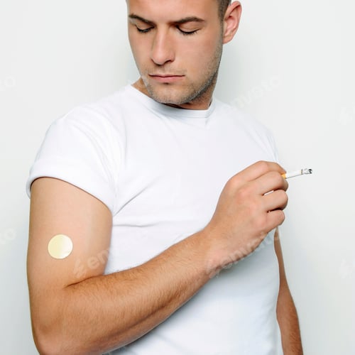 Preview: Young Man Wearing A Nicotine Patch And Smoking, Studio Shot