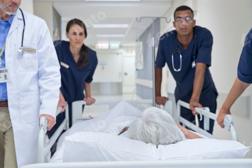 Preview: Emergency Medical Team Wheeling A Patient Along The Hospital Corridor