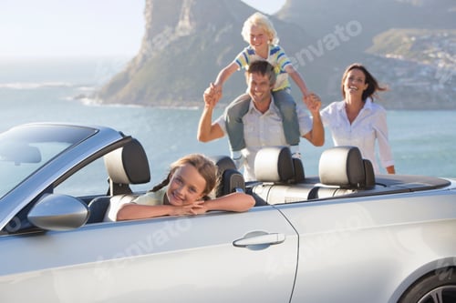 Preview: Happy Family On A Vacation Enjoying On A Hill Top Near The Sea