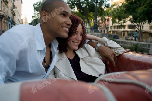 Preview: Young Multi-Ethnic Couple In Car, Havana, Cuba