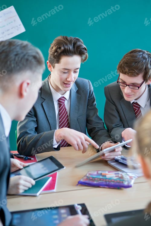 Preview: Vertical Shot Of A Group Of High School Students Using Digital Tablets In A Classroom.