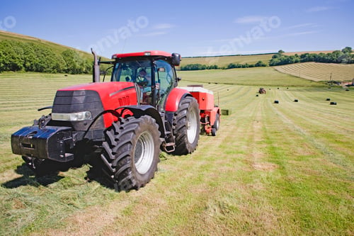 Preview: Close Up Of A Tractor Baling Hay In The Field