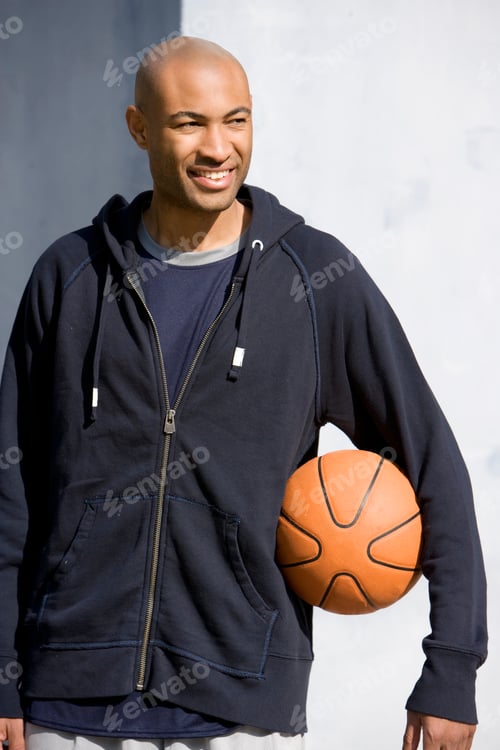 Preview: Portrait Of Young African American Man Holding A Basketball