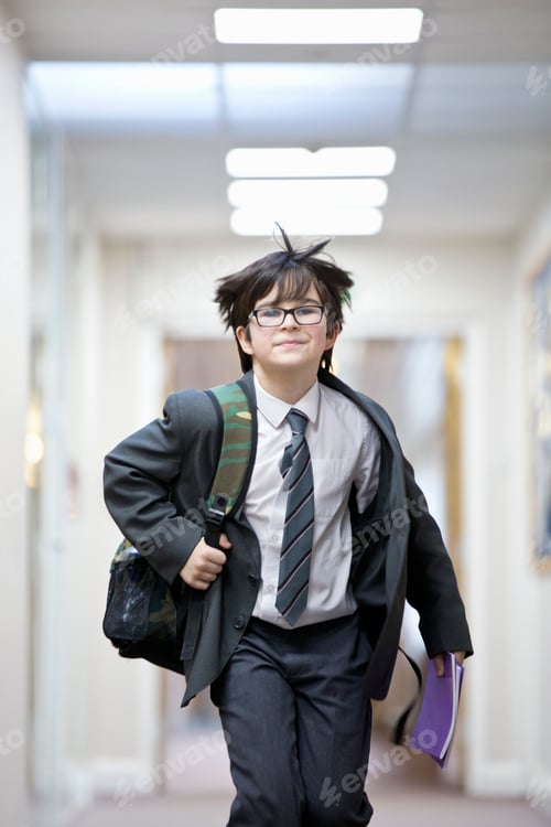 Preview: Portrait Smiling Middle School Student Running In School Corridor
