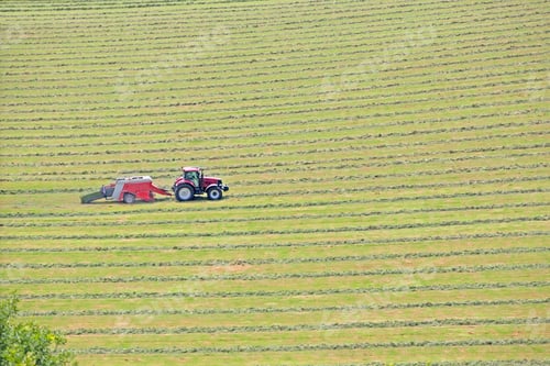 Preview: Tractor Baling Hay In Field