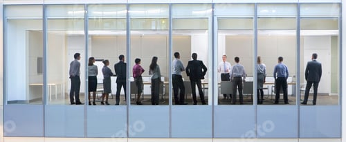 Preview: Wide Shot Through An Office Window With A Group Of People Attending A Meeting.