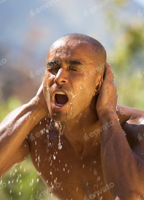 Preview: Young Man Splashing Water On Face, Close-Up