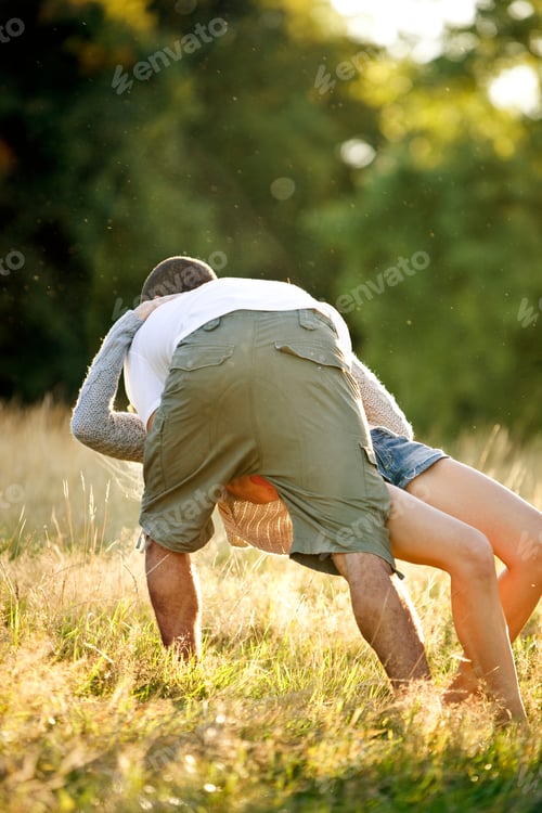 Preview: A Young Couple Playing In A Field