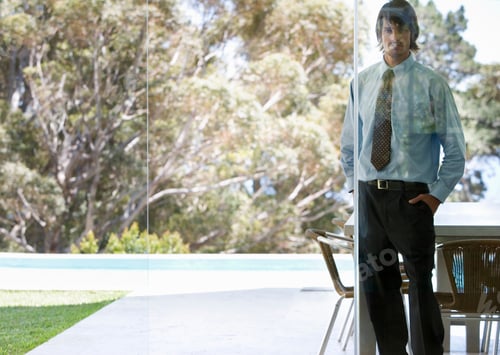 Preview: A Businessman Standing In A Garden