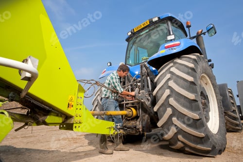 Preview: Farmer Attaching Farming Equipment To The Tractor