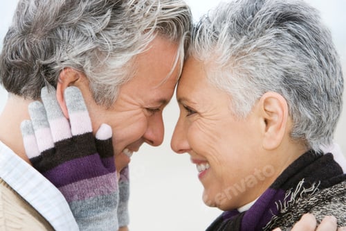 Preview: A Senior Couple Embracing Wearing Gloves