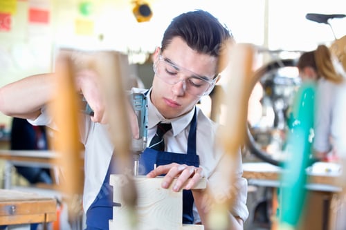 Preview: High School Student Drilling Wood In Shop Class