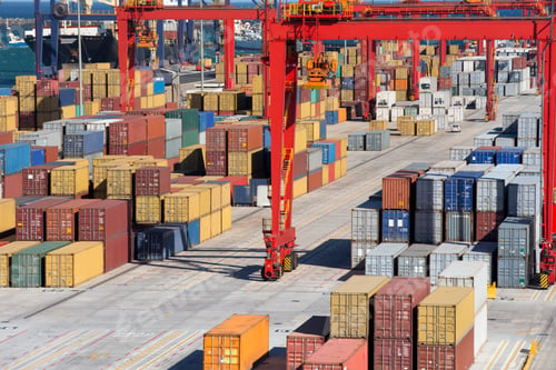 Preview: Wide Shot Of The Pathway At A Commercial Dock With Cranes And Cargo Containers.