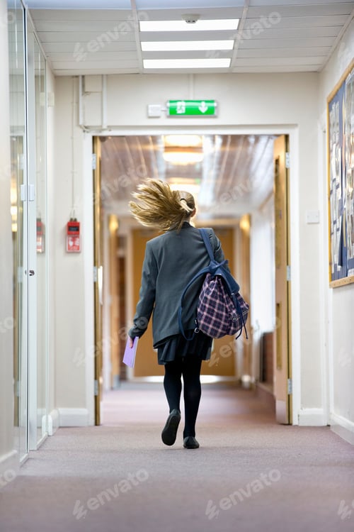Preview: Middle School Student Running In School Corridor