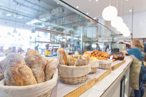 Preview: Baskets Of Bread Arranged In A Row On The Counter Of A Bakery