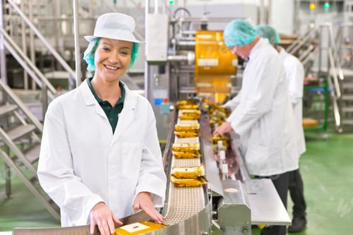 Preview: Portrait Smiling Worker At Production Line In Cheese Processing Plant