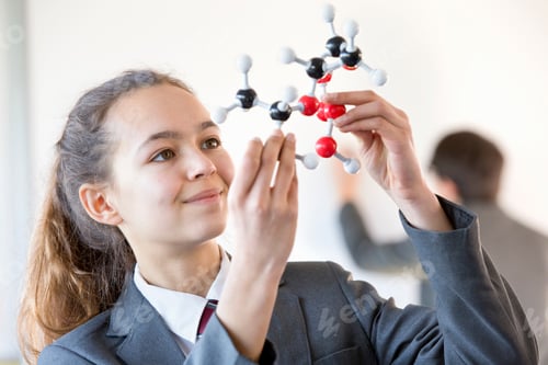 Preview: Smiling High School Student Examining Molecule Model In Science Class