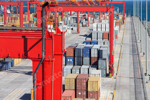 Preview: Wide Shot Of A Commercial Dock With Cranes And Stacked Cargo Containers.