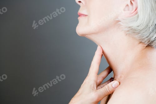 Preview: A Senior Woman Touching Her Neck