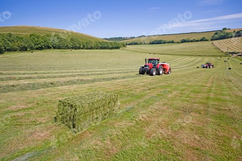 Preview: Tractors And A Wrapped Bale In The Field