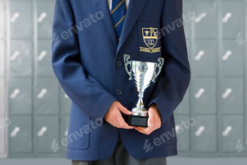 Preview: Close Up Of School Pupil In Uniform Holding Trophy