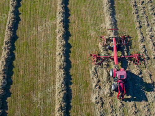 Preview: Tractor Turning Grass To Dry And Make Into Hay